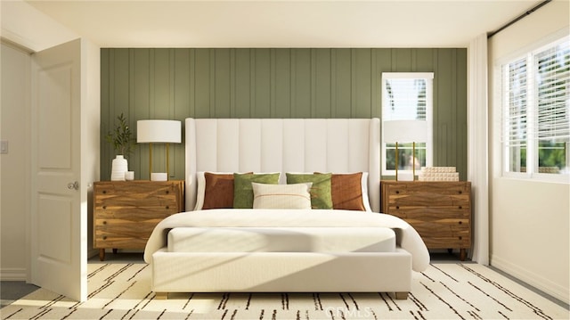 bedroom with baseboards and multiple windows