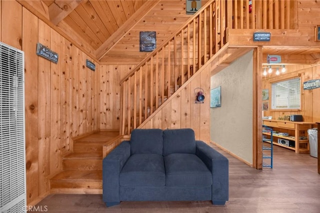 747 Holmes Ln, Sugarloaf, CA 92386 - living area featuring wooden walls, a heating unit, stairway, wood finished floors, and wooden ceiling