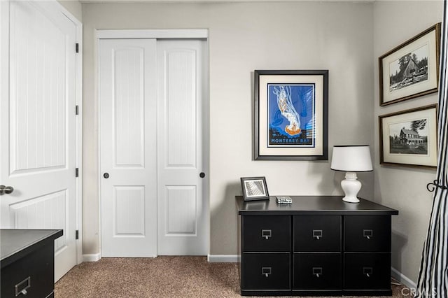 bedroom with carpet flooring, a closet, and baseboards