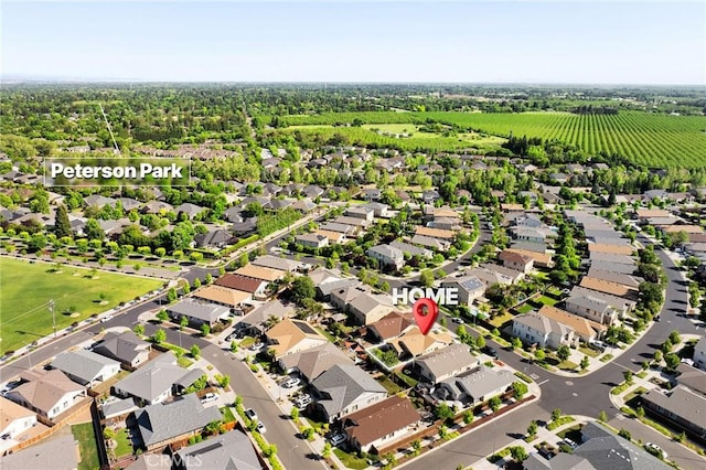birds eye view of property with a residential view
