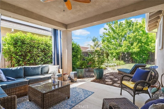 view of patio featuring a ceiling fan, outdoor lounge area, and a fenced backyard