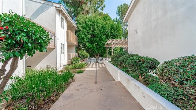 surrounding community featuring a gate and a pergola