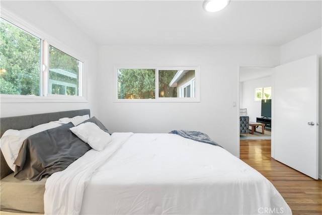 bedroom with wood finished floors