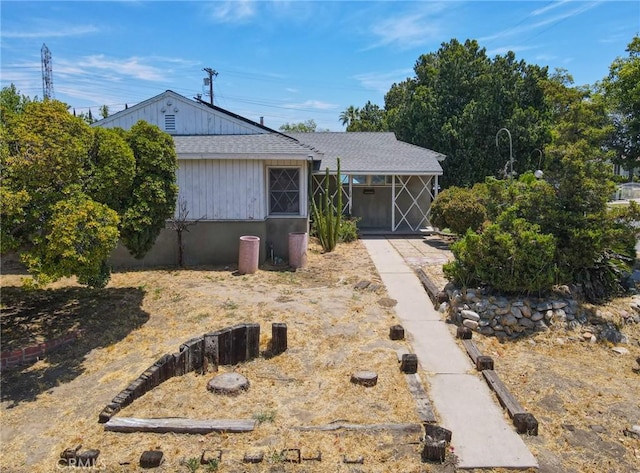 bungalow-style house featuring a shingled roof