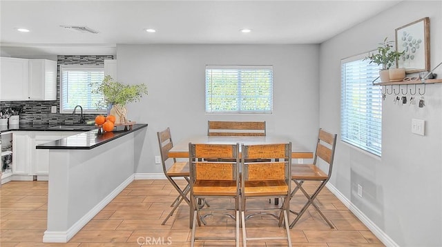1261 W 13th St, San Bernardino, CA 92411 - dining space with baseboards, light wood-style floors, visible vents, and recessed lighting