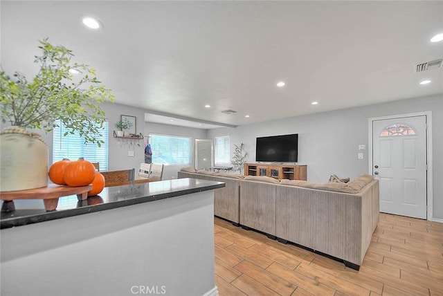 1261 W 13th St, San Bernardino, CA 92411 - kitchen with recessed lighting, light wood finished floors, open floor plan, and visible vents