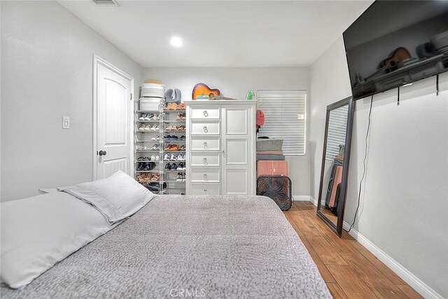 1261 W 13th St, San Bernardino, CA 92411 - bedroom featuring recessed lighting, baseboards, and wood finished floors