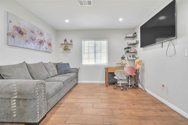 1261 W 13th St, San Bernardino, CA 92411 - living room featuring baseboards, recessed lighting, visible vents, and wood finished floors