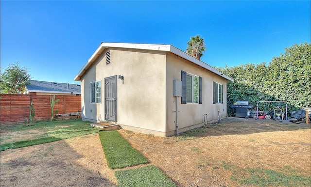 1261 W 13th St, San Bernardino, CA 92411 - view of home's exterior with fence and stucco siding