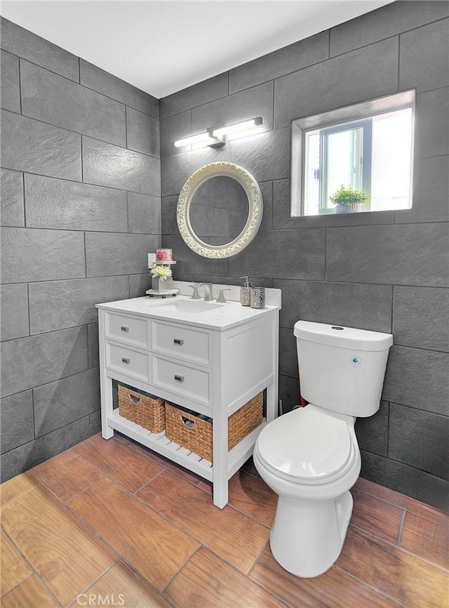 1261 W 13th St, San Bernardino, CA 92411 - bathroom featuring toilet, vanity, and wood finished floors
