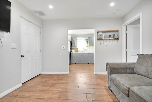 1261 W 13th St, San Bernardino, CA 92411 - living area featuring baseboards, recessed lighting, visible vents, and light wood-type flooring
