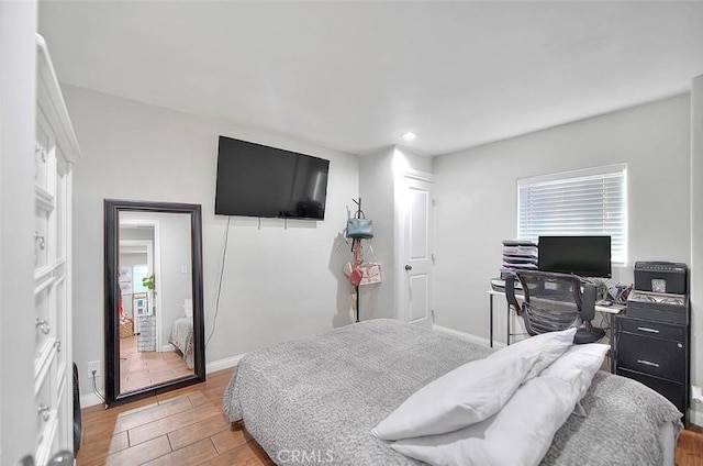 1261 W 13th St, San Bernardino, CA 92411 - bedroom featuring multiple windows, light wood-style floors, baseboards, and recessed lighting