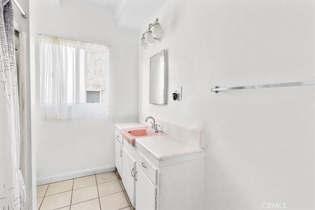 full bathroom featuring vanity, baseboards, and tile patterned floors