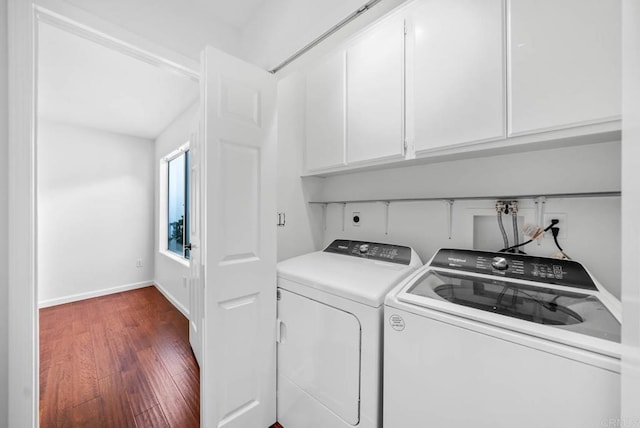 4704 Cordoba Way, Oceanside, CA 92056 - laundry area with cabinet space, dark wood-style flooring, washer and dryer, and baseboards