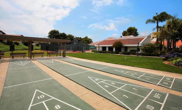 4704 Cordoba Way, Oceanside, CA 92056 - surrounding community with shuffleboard, uncovered parking, fence, and a lawn