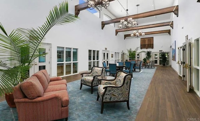4704 Cordoba Way, Oceanside, CA 92056 - living area with beam ceiling, an inviting chandelier, high vaulted ceiling, and wood finished floors