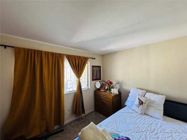 carpeted bedroom with baseboards