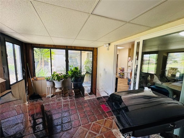sunroom / solarium with a drop ceiling