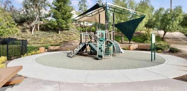 communal playground featuring fence