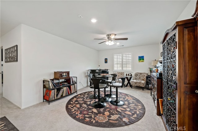 office featuring visible vents, baseboards, ceiling fan, light colored carpet, and recessed lighting