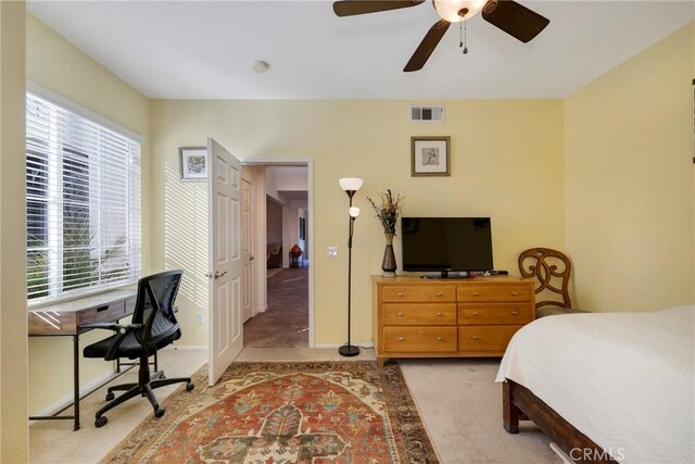 38493 Falkirk Dr, Murrieta, CA 92563 - bedroom with an office area, light colored carpet, and ceiling fan