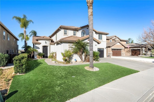 38493 Falkirk Dr, Murrieta, CA 92563 - mediterranean / spanish house featuring concrete driveway, a tiled roof, a front yard, stucco siding, and an attached garage