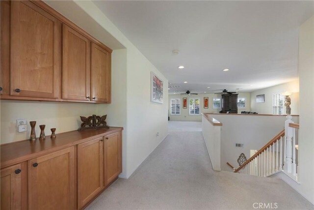 38493 Falkirk Dr, Murrieta, CA 92563 - corridor featuring light colored carpet, an upstairs landing, and recessed lighting