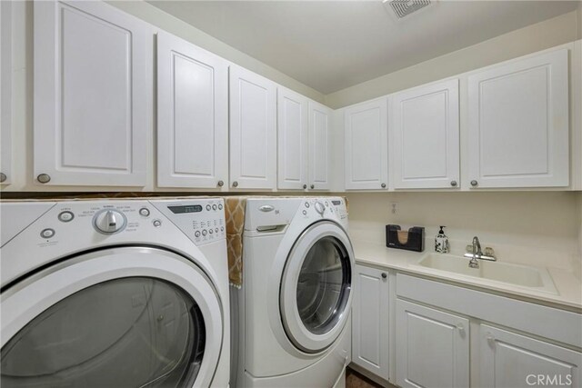 38493 Falkirk Dr, Murrieta, CA 92563 - laundry room with separate washer and dryer and cabinet space