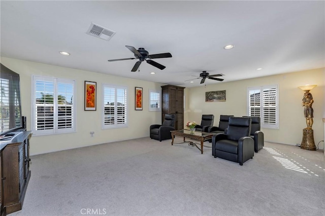38493 Falkirk Dr, Murrieta, CA 92563 - living room with light colored carpet, healthy amount of natural light, recessed lighting, and a ceiling fan