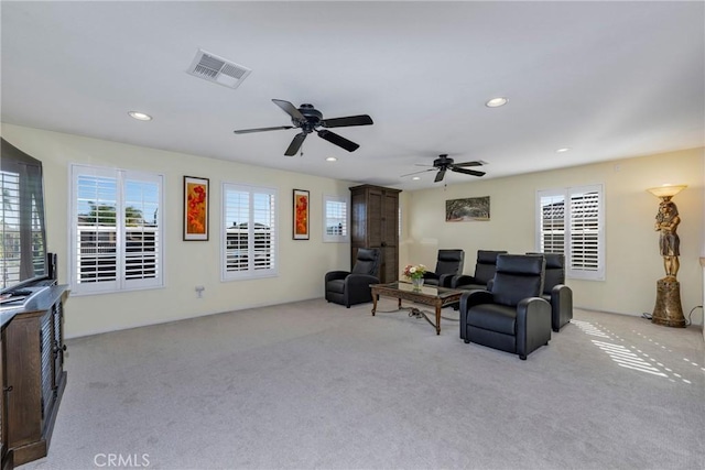 38493 Falkirk Dr, Murrieta, CA 92563 - living room with light colored carpet, healthy amount of natural light, recessed lighting, and a ceiling fan