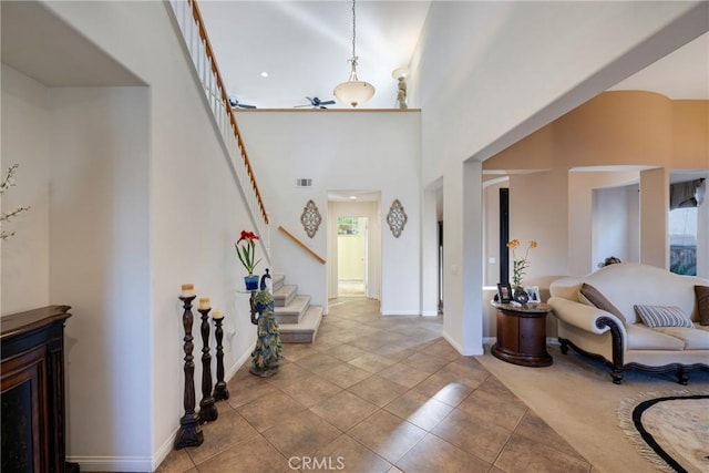 38493 Falkirk Dr, Murrieta, CA 92563 - tiled entryway with stairway, baseboards, and a towering ceiling