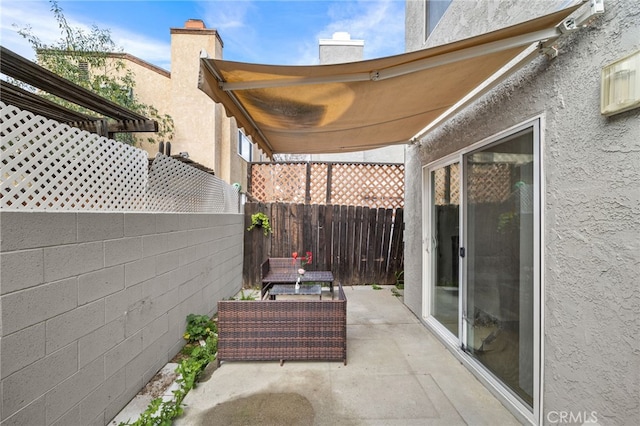 view of patio / terrace with fence