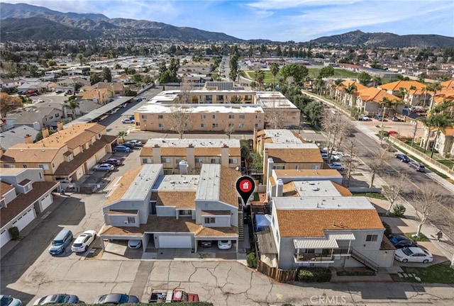 birds eye view of property with a mountain view and a residential view