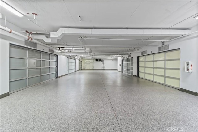 22065 Pacific Coast Hwy Unit 3, Malibu, CA 90265 - garage featuring baseboards and visible vents