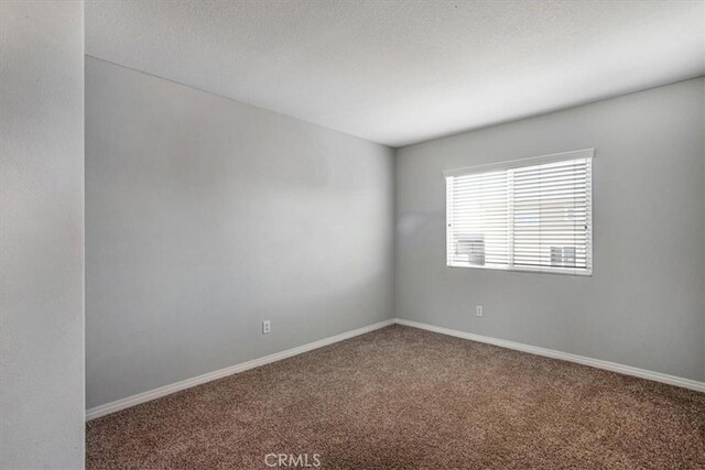 13167 Hollister St, Hesperia, CA 92344 - spare room featuring carpet flooring, baseboards, and a textured ceiling
