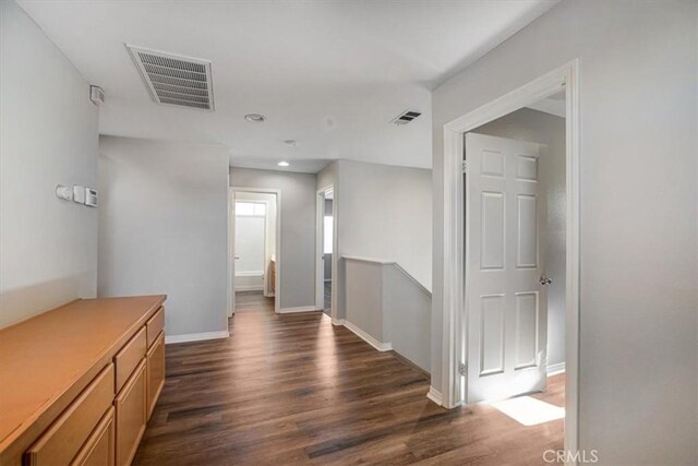 13167 Hollister St, Hesperia, CA 92344 - corridor featuring dark wood-type flooring, baseboards, and recessed lighting