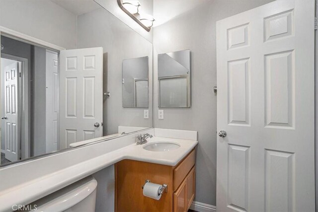 13167 Hollister St, Hesperia, CA 92344 - half bathroom featuring toilet and vanity