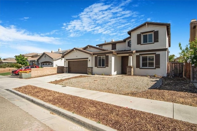 13167 Hollister St, Hesperia, CA 92344 - view of front facade featuring stucco siding, a garage, and concrete driveway