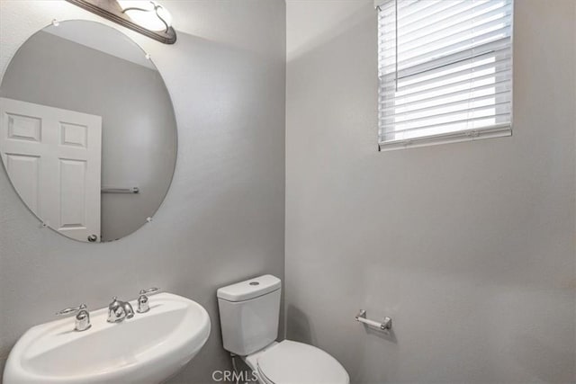 13167 Hollister St, Hesperia, CA 92344 - half bathroom featuring a sink and toilet