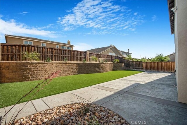 13167 Hollister St, Hesperia, CA 92344 - view of yard featuring a patio area