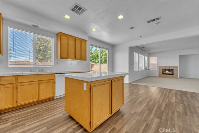 43629 Rucker Ct, Lancaster, CA 93535 - kitchen featuring tile countertops, visible vents, white dishwasher, and a sink