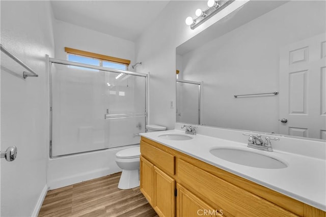 43629 Rucker Ct, Lancaster, CA 93535 - bathroom with double vanity, toilet, wood finished floors, and a sink