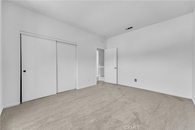 43629 Rucker Ct, Lancaster, CA 93535 - unfurnished bedroom with a closet, visible vents, baseboards, and carpet floors