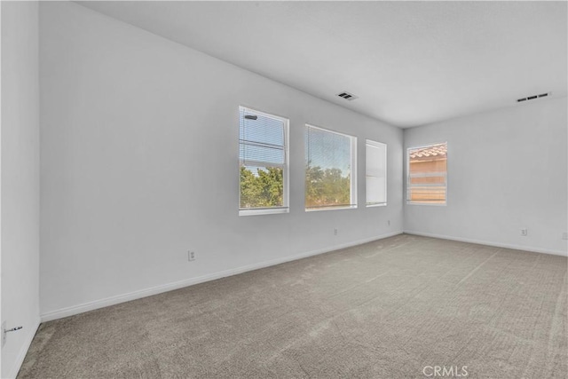43629 Rucker Ct, Lancaster, CA 93535 - spare room with visible vents, baseboards, and light carpet