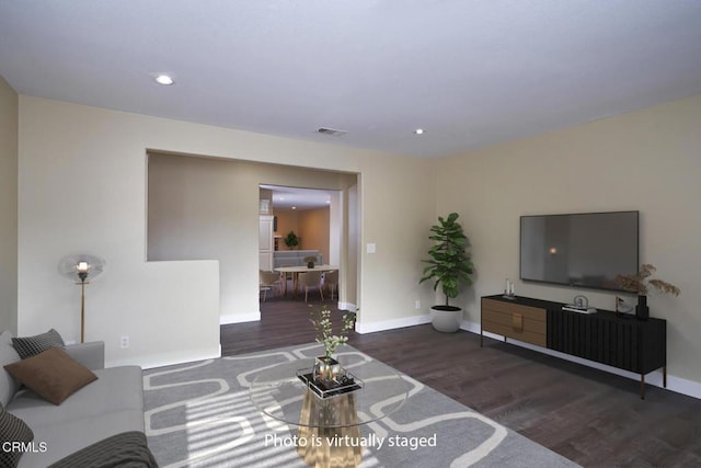1700 Arlene Ave, Oxnard, CA 93036 - living area featuring wood finished floors, baseboards, and recessed lighting