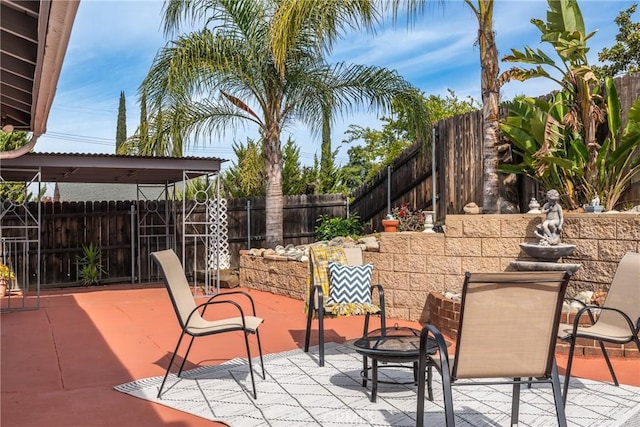 35230 San Carlos St, Yucaipa, CA 92399 - view of patio / terrace featuring an outdoor fire pit and a fenced backyard