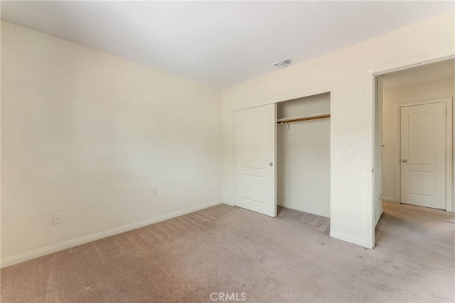 35230 San Carlos St, Yucaipa, CA 92399 - unfurnished bedroom with light colored carpet, baseboards, a closet, and visible vents