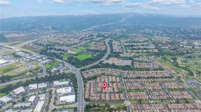 birds eye view of property featuring a mountain view