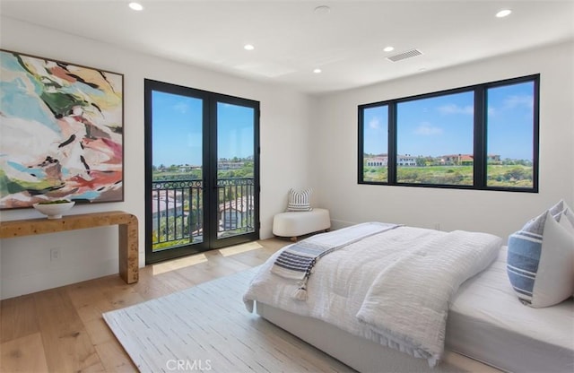 4 Sunset Cv, Newport Coast, CA 92657 - bedroom with multiple windows, visible vents, wood finished floors, and access to exterior