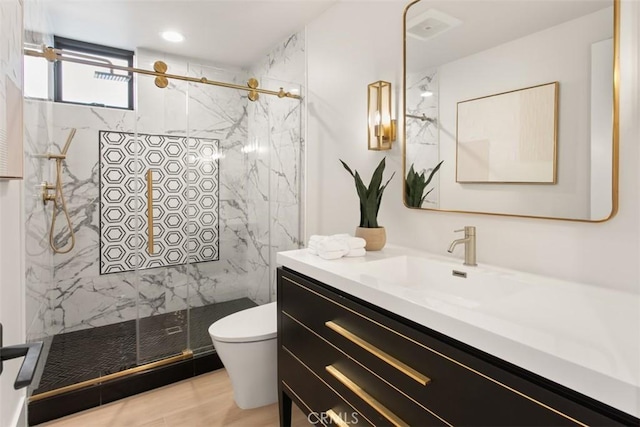 4 Sunset Cv, Newport Coast, CA 92657 - bathroom with toilet, vanity, wood finished floors, and a marble finish shower
